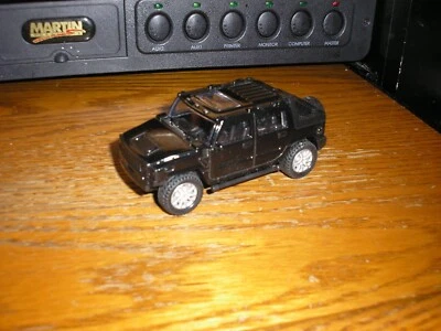 BOM 1/43? 4 1/4" 4x4 Hummer H2 SUT? Preto com ação pull back frete grátis - Imagem 1 de 4