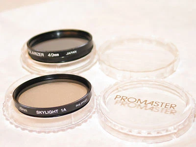 2 filters, 49mm POLARIZER & SKYLIGHT (1A) FILTERS W/CASES....excellent - Image 1 of 2