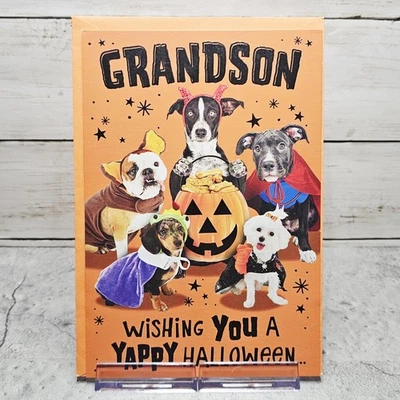 Tarjeta de felicitación de Halloween para perros nietos en disfraces sello naranja Foto 1 de 4