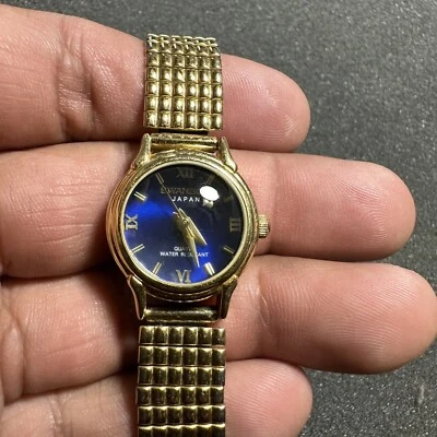 Reloj de cuarzo Swanson Miyota para dama tono dorado esfera azul funcionando batería nueva WR Foto 1 de 4
