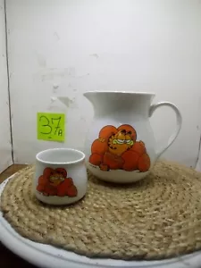 Jarra de jugo de naranja Garfield Enesco 1978 y una taza de jugo piezas de repuesto - Imagen 1 de 7