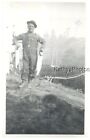 FOUND B&W PHOTO G_8089 MAN IN OVERALLS HOLDING TWO FISH