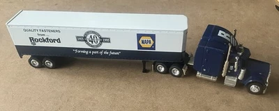 NAPA/ ROCKFORD PETERBILT 379 SEMI BANK 1/64 SPECCAST DIECAST (W COA #293) - Image 1 of 4
