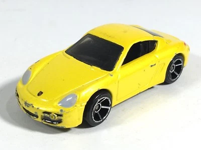 Porsche Cayman S 2007 Metalflake amarillo HW nuevos modelos Malasia Hot Wheels Foto 1 de 4