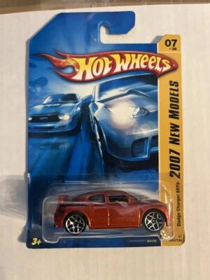 2007  Hot Wheels   New Models  Orange  DODGE CHARGER SRT8  Card #007 - Image 1 of 4