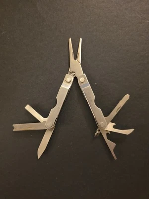 Vintage Mini 7 in 1 Pocket Tool (Bottle Opener, Needle Nose Pliers, 1.5" Blade,) - Image 1 of 4