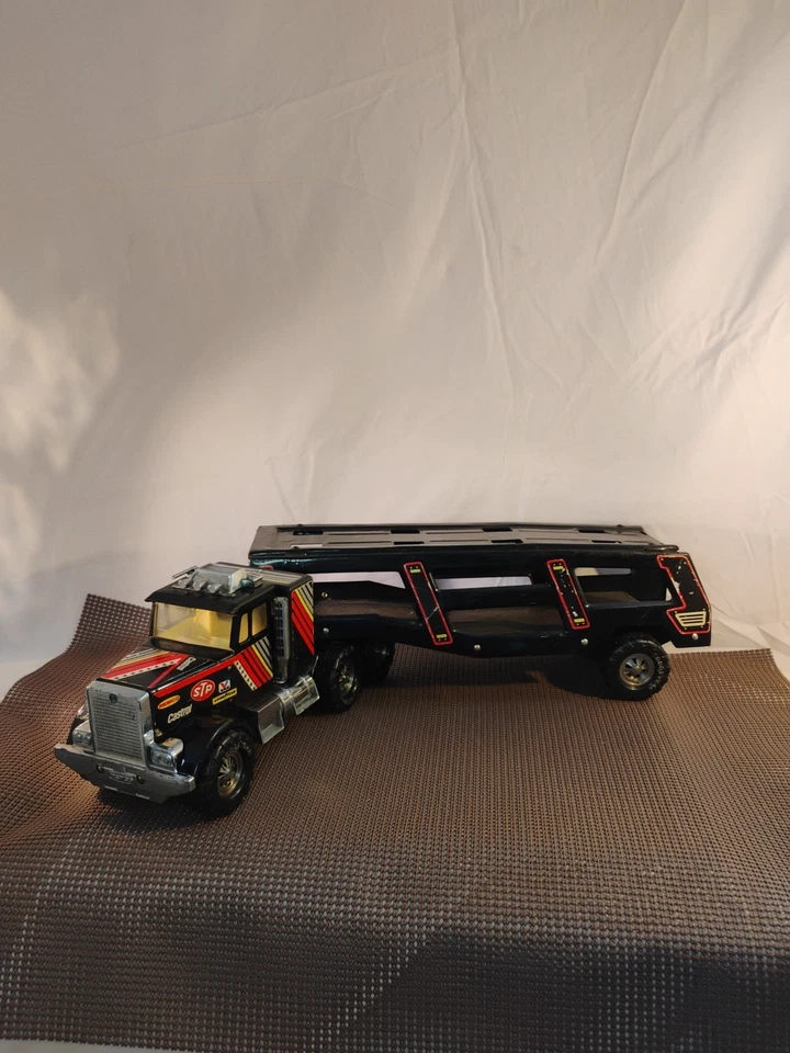 🔥Tractor de juguete de metal Remco Castrol STP Goodyear SEMI de los años 80 plataforma grande Foto 1 de 4