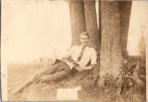1909 Elmwood Wisconsin Man Laying Against Tree RPPC Real Photo Postcard Posted - Picture 1 of 5