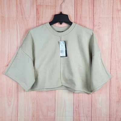 Sudadera corta Reebok X Cardi B para mujer XL beige logotipo forrada de lana térmica invierno Foto 1 de 4