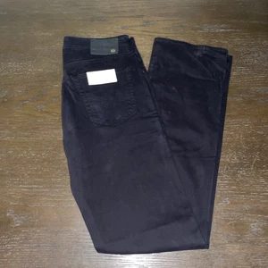 Jeans AG ADRIANO GOLDSCHMIED neri THE PROTEGE GAMBA DRITTA nuovi con etichette taglia 30x35 - Foto 1 di 4