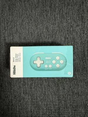 Teal 8Bitdo Zero 2 Bluetooth Gamepad para Switch/Windows/Mac/Android/Pie Foto 1 de 2