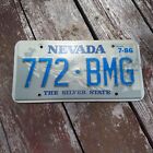 1986 Nevada License Plate - "772 BMG" (blue on silver) 7-86 Sticker THE SILVERST