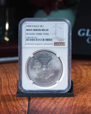 2000 Silver Eagle | Mint Error NGC MS69 Reverse Struck Thru - Image 1 of 4