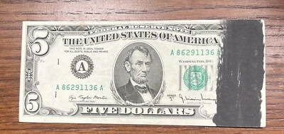$5 1977-A With A Black Ink Smear On The Right Front Of Face.  Note Grades AU - Image 1 of 2