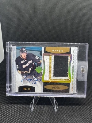 2013-14 Corey Perry Upper Deck Ultimate Autographed Threads Jersey /10 (UAT-PE) - Image 1 of 2