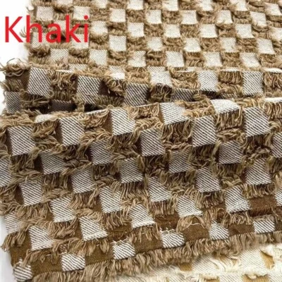 Tela de mezclilla a cuadros rasgados de 10 oz por metro para material de fabricación de ropa de jeans Foto 1 de 4