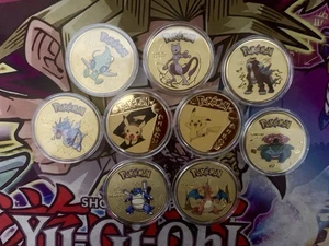 Pokemon Gold Sammelmünzen Konvolut Charizard Mewtwo Pikachu Celebi - Bild 1 von 4