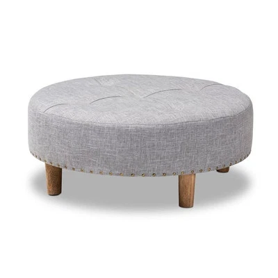 Mesa de centro otomana Baxton Studio Vinet de tela acolchada y madera en gris claro Foto 1 de 4