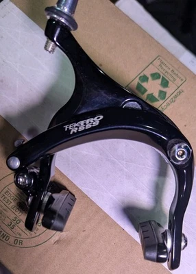 FRENO PINZA CARRETERA TEKTRO R559 - MONTAJE TUERCA EMPOTRADA DOBLE PIVOTE DELANTERO ALTO Foto 1 de 3