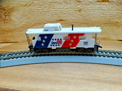 Atlas HO Scale 33' Santa Fe SL-SF 1776 Spirit of 76 Cupula Caboose with Chimney - Image 1 of 4