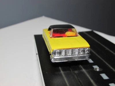 LIONEL:  Yellow/Black '64 "Ford Galaxie" Hardtop (with running chassis) - Image 1 of 4