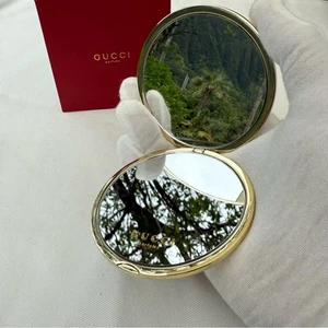 Espejo compacto Gucci nuevo en caja dorado doble cara bolsillo maquillaje espejo VIP - Imagen 1 de 8