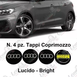 N. 4 Tappi Coprimozzo per Audi 68 mm. nero CERCHI STEMMA Logo BORCHIE ruote auto - Foto 1 di 7