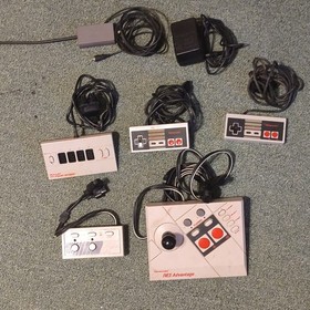 2 Controllers, Four Score,Turbo Blaster, NESadvantage,Power supply, & RF adapter