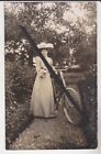 PHOTO POSTCARD - LADY WITH A BICYCLE