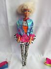 Vintage Barbie with an assortment of outfits very good condition