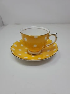 Taza de té y platillo Royal Albert Bone China lunares amarillos y blancos profundos - Imagen 1 de 8