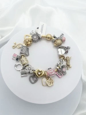 Pulsera Linx de oro amarillo con dijes temáticos de mamá rosa Foto 1 de 4