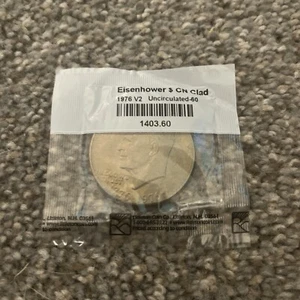 1976 V-2 EISENHOWER DOLLAR CN PLAD NON CIRCOLATA MONETA SIGILLATA LITTLETON COIN CO. - Foto 1 di 2