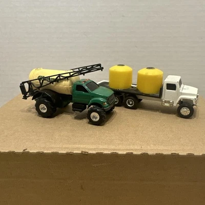 1/64 Ertl Ford F-750 Sprayer Truck With A International Water Truck FREE SHIPING - Image 1 of 4