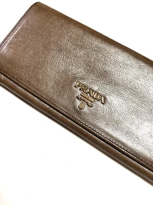 CARTERA LARGA PRADA VINTAGE ORO METAL LOGO CUERO MONEDA ITALIA ORO CHAMPÁN Foto 1 de 4
