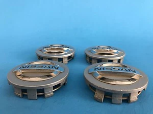 NISSAN CENTER CAPS SILVER GENUINE FACTORY ORIGINAL OEM 40342-AU510 OEM SET OF 4 - Picture 1 of 6