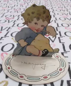 TARJETA DE LUGAR DE PIE de colección pelo rizado niño comiendo pudín H5008 EE. UU. - Imagen 1 de 6