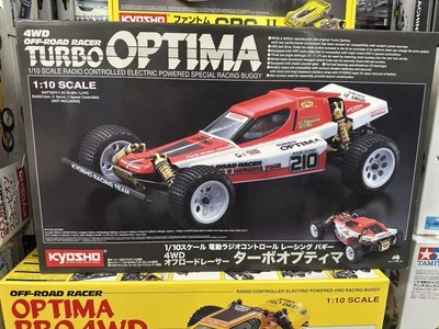NIB Kyosho 30619C Turbo Optima Gold Kit 4WD radio controlled model car - Image 1 of 3