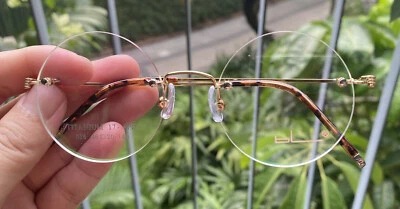 Nuevo Marco de gafas redondas sin montura para hombres Gafas redondas de titanio Gafas redondas doradas Foto 1 de 4