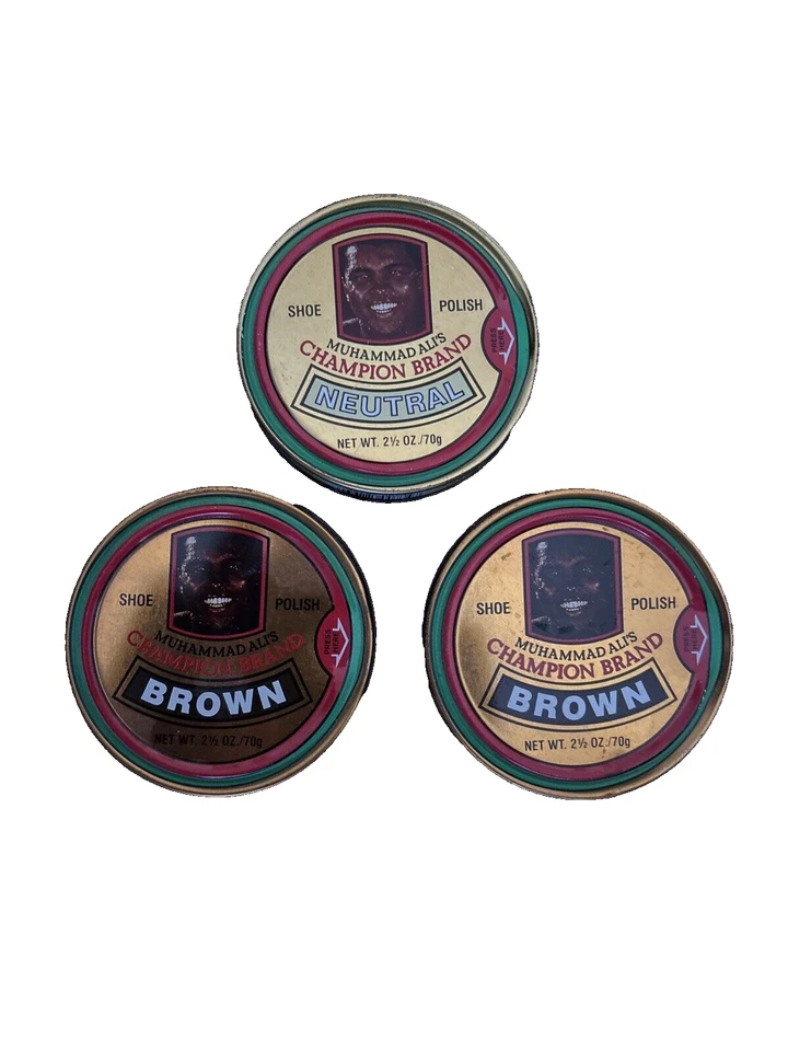 THREE VINTAGE MUHAMMAD ALI CHAMPION BRAND SHOE POLISH TINS (2 BROWN, 1 NEUTRAL) - Image 1 of 1
