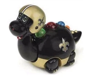 Juguete musical de dinosaurio del equipo de los New Orleans Saints de la NFL en caja sellada - Imagen 1 de 3