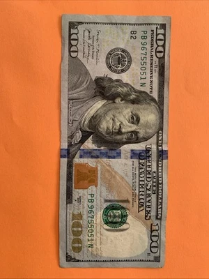 100 Bill with a foreign things like a hat or UFO object and one  in the obverse  - Image 1 of 4