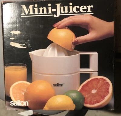 Mini exprimidor eléctrico de frutas cítricas Salton JC-1 de colección caja abierta Foto 1 de 3