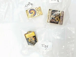 Konvolut 3 Olympia Pins (2) 1988 Seoul Minutemaid und (1) 1984 Los Angeles Motor - Bild 1 von 2