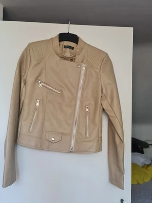 Beige Faux leather PVC Biker Jacket.Size small.Fake zips pockets. - Image 1 of 4