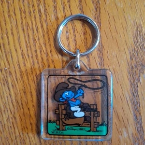 Vintage Schlumpf Schlüsselanhänger Cowboy Lasso Peyo 1981 Souvenir Keyring - Bild 1 von 3