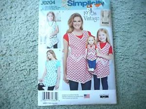 Simplicity J0204 misses, childs, & 18" doll aprons Sizes S-L UNCUT - Picture 1 of 2