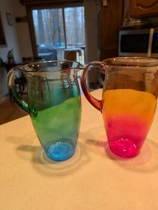 NEW Set Of Two Plastic 52 oz Pitchers 8.25" Festive Green, Blue/Orange, Pink Hue - Picture 1 of 8