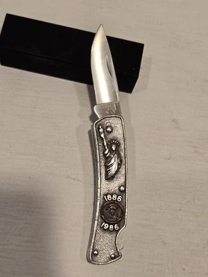 1986 BUCK 825 Statue of Liberty Commemorative Folding Pocket Knife  - Image 1 of 4