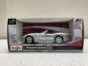 Maisto Premiere DC 1999 Shelby Series One, 1:24 Scale Model, Color Metallic Gray - Picture 1 of 7